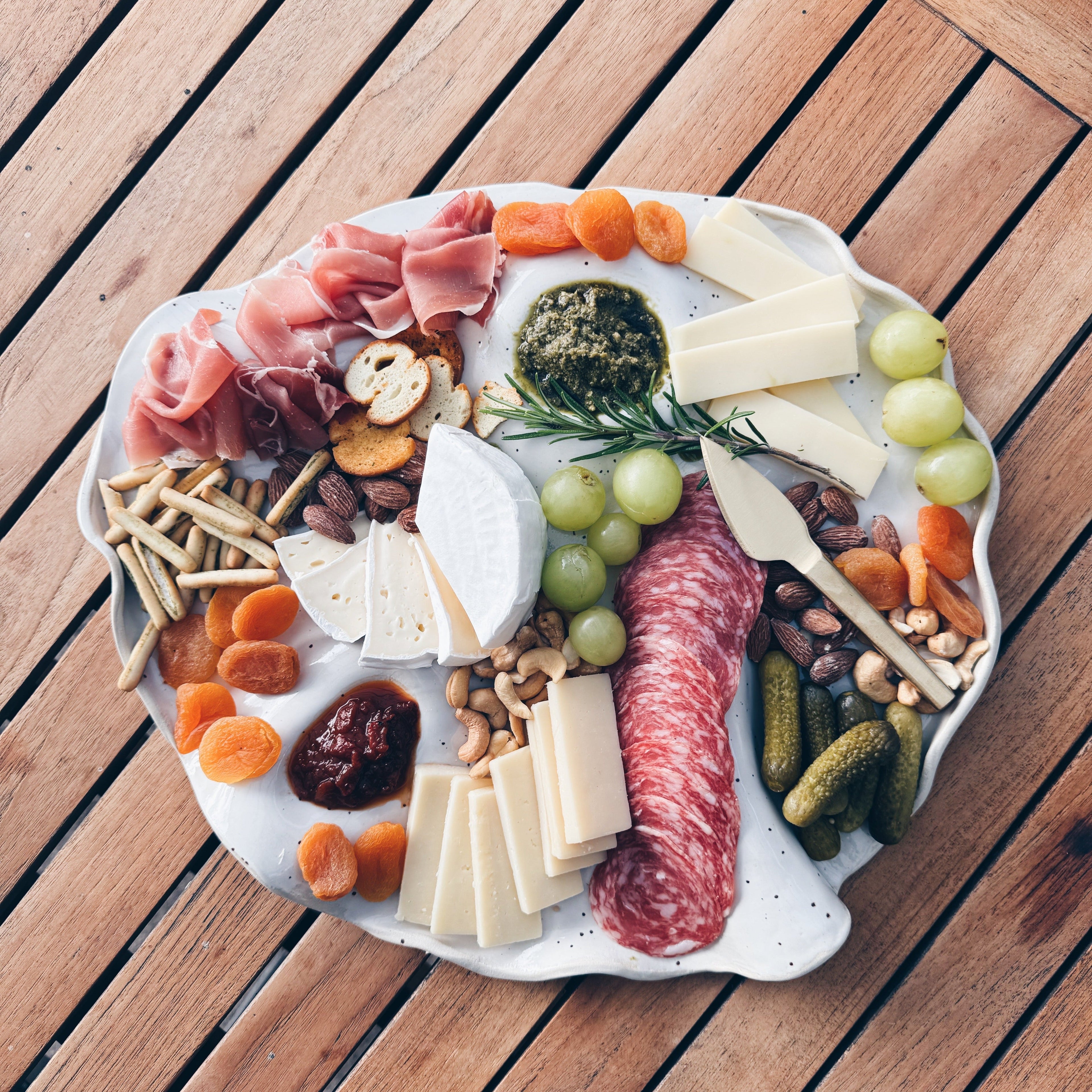 Form ceramic serving platter with meats and cheese