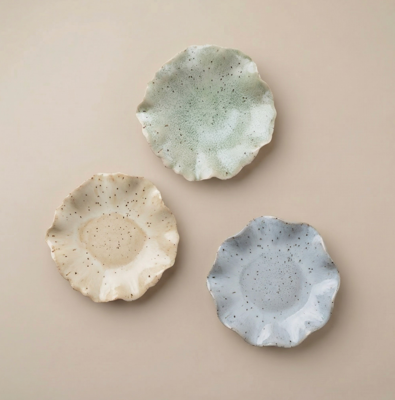 Ceramic wall art attached to the wall in three colours