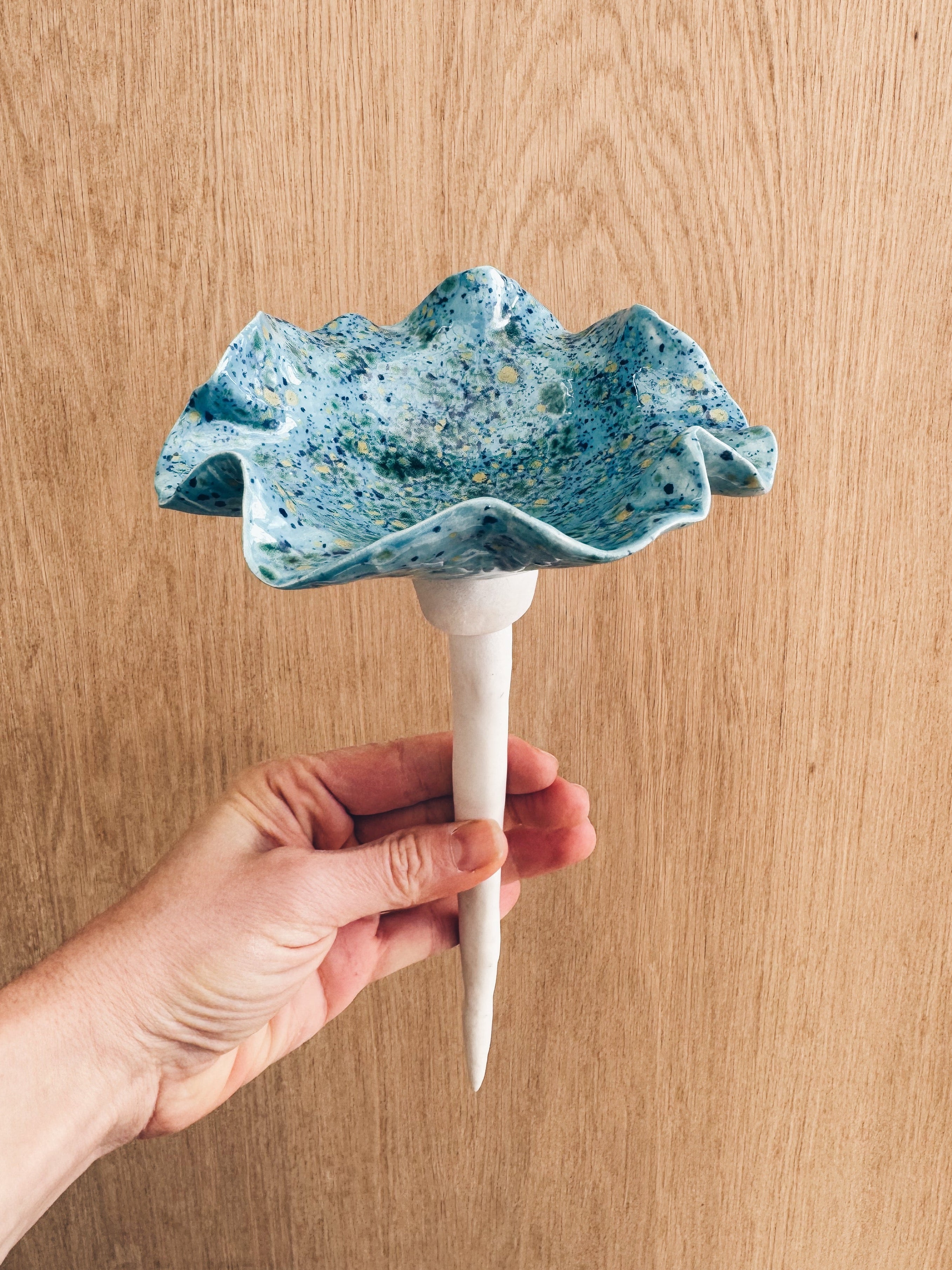 Vibrant blue and speckled handmade stoneware bee bowl. A beautiful garden addition designed specifically for bees and butterflies to safely