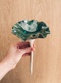 Deep green handmade stoneware bee bowl that blends seamlessly into foliage. Give bees and butterflies a safe resting spot in your summer garden