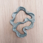 Ceramic coral sculpture on wooden wall
